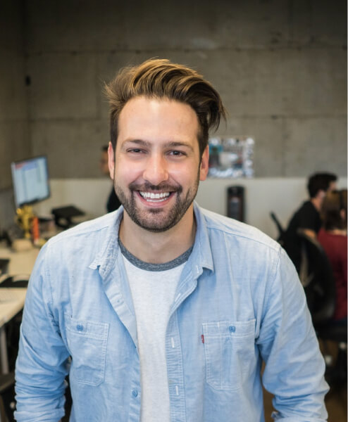 Portrait of Leslie Alexander, a Marketing Coordinator, smiling and wearing a light blue shirt.